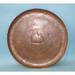 A Newlyn copper circular tray with embossed lugger decoration, impressed mark NEWLYN, 33.5cm