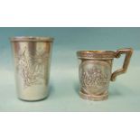 A small 19th century Russian mug with panels depicting Bacchanals within vine borders, 5.5cm,