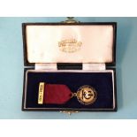 An enamelled 9ct gold Transport & General Workers Union medallion, with ribbon and 9ct gold pin, (