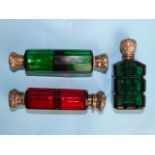 A Victorian green glass double-ended scent bottle with silver mounts, another, similar, of cranberry