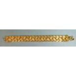 A Thai gold bracelet of geometric links, with 'S' clasp, bracelet 17.5cm long, 1.5cm wide, marked '