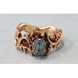 A 9ct gold ring of naturalistic form set blue stone, size M, 5.7g.