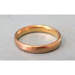 A high-carat gold wedding band, marks rubbed, size O, 4.8g.