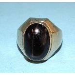 A 14ct gold ring set a large chatoyant black stone, size S, 11.7g.