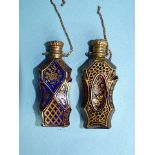 Two Continental scent bottles, one amethyst, the other blue coloured glass, with silver tops,