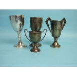 A collection of four small trophy cups, all engraved, 7cm-11cm, various dates, ___5oz.