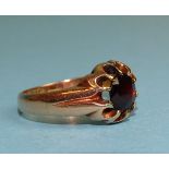 A gentleman's 9ct rose gold ring claw-set a round-cut garnet, size X½, 7g.