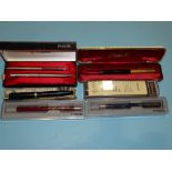 A Parker Duofold fountain pen, a Parker fountain pen and ballpoint pen set, cased, another Parker