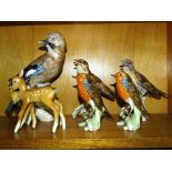 A collection of five Goebel bird ornaments, including a jay, 23.5cm high, two song thrushes 16cm, (