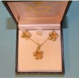 A 14k yellow gold pendant in the form of a five-petalled flower, on chain and a pair of matching ear