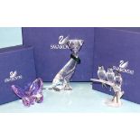 A Swarovski glass group of three swallows on a frosted branch, a figure of a stylised cat wearing