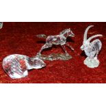A Swarovski glass polar bear, an ibex, (one ear detached) and a horse, (all unboxed).