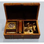 A miniature brass nautical navigational set comprising a sextant, telescope, compass and sand timer,