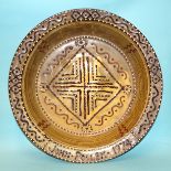 John Pollex, a studio pottery large slipware shallow bowl, with geometric wavy lines and dot