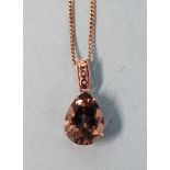 A 9ct gold pendant set quartz, on 9ct gold curb-link chain, 6.4g.