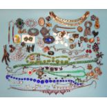 A quantity of vintage and later jewellery, including figural brooches and some named items by Monet,