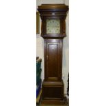 An oak-cased 30-hour long case clock with bell-striking chain-driven movement, 196cm high.