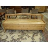 A stripped pine Danish bed/low settle, 188cm wide, 71cm high, 50cm deep.