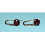 A pair of 9ct gold drop earrings set garnets and diamond points, 1.7g.