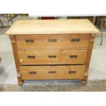 A stripped pine chest of three long drawers, 107cm wide, 81cm high, 53cm deep.
