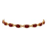 Armband mit 14 facettierten Granaten,feine Almandine, GG 18K, 16,7 gr, L: ca. 21 cm, 2