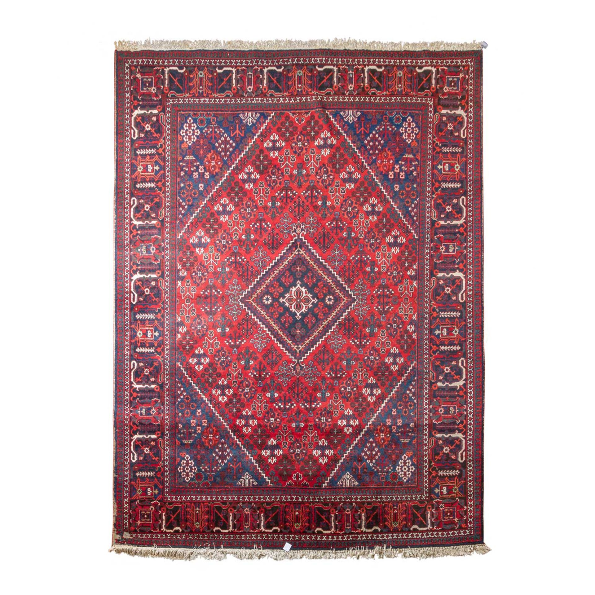 Orientteppich. JOSHAGHAN/PERSIEN, 20. Jh., 337x245 cm. Der dunkelrote Fond des Innenfe