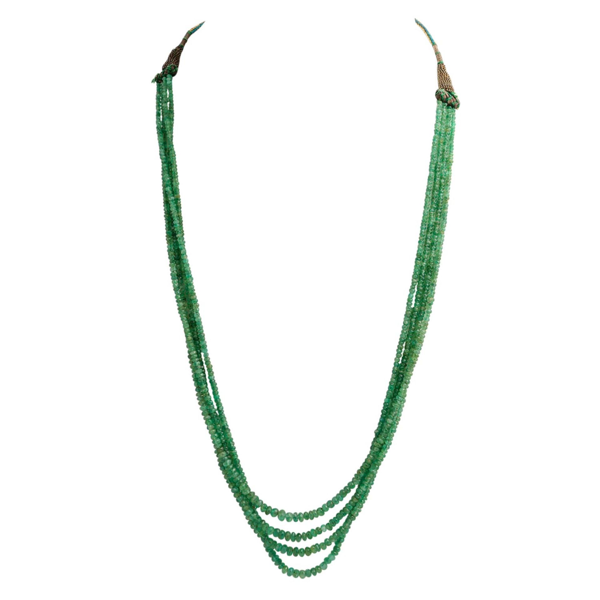 Smaragdkette 4-reihig, facettierte Linsen ca. 2,5-5 mm im Verlauf, tansparent bis tran