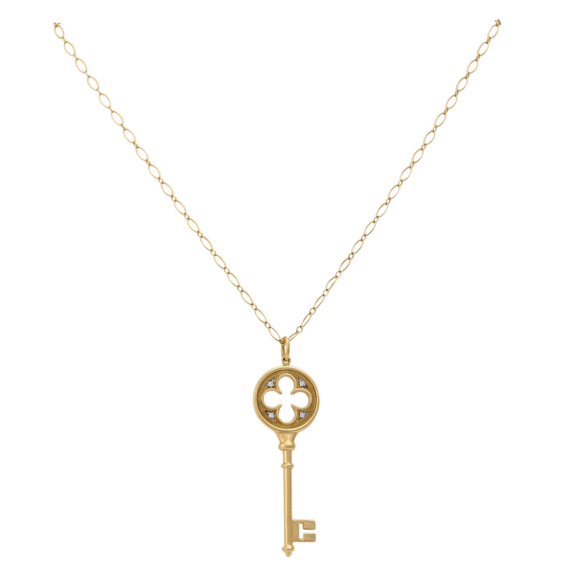 TIFFANY & CO Anhänger "Quatrefoil Key"KP (2009): 1.265 €, mit vier Brillanten, zu