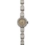 ROLEX Schmuckuhr mit Diamanten zus. ca. 10,4 ct,Brillant- und Baguetteschliff, ca. WEI