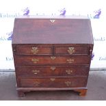 19th century oak bureau with two short over three graduating long drawers, with fitted interior,