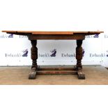 18th century style oak extending dining table with two crossbanded adjustable leaves, on column