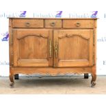 20th century French walnut sideboard of three short drawers above two cupboard doors, cabriole