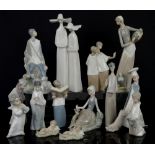 Quantity of Lladro and Nao figurines including nuns, choir boys, priest with book, three wise men