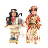 WITHDRAWN Two Native American Armand Marseille dolls, one carrying two bows, marked 14/0, 33cm high,