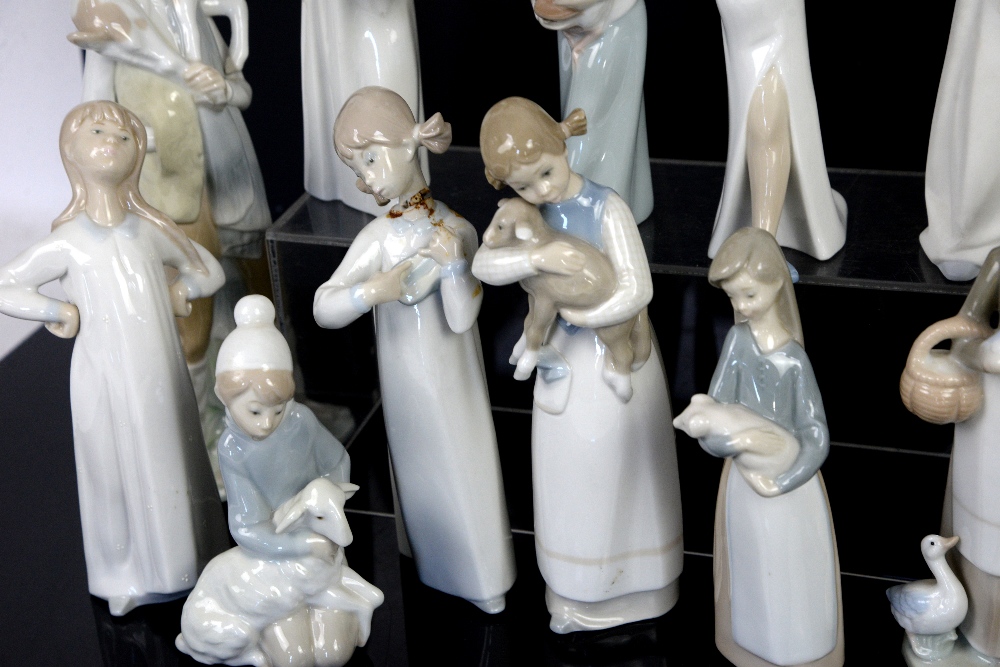 Quantity of Lladro figurines; figure holding lamb, figure holding goat, girl with chicken, - Image 10 of 16