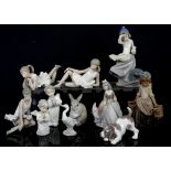 Lladro brown glaze girl carrying two water pails, and ten other figurines including Nao and a Lladro