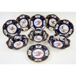 Royal Vienna six plates and three bowls decorated with exotic birds, cobalt ground with gilt