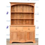 20th century pine dresser, the three tier plate rack above two short drawers and two cupboard