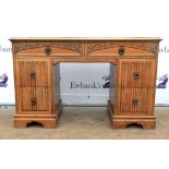 19th/20th century oak kneehole desk, with two short drawers above four further short drawers, on