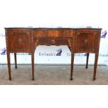 20th century mahogany serpentine sideboard with single central drawer above frieze flanked by two