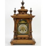 Oak mantel clock of architectural form, chapter ring with Arabic numerals, eight day movement with