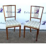Pair of early 20th century mahogany dining chairs with line inlay.