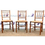 Set of five 19th century oak bobbin back dining chairs on tapered supports.