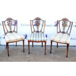 Set of three early 20th century rosewood dining chairs with marquetry inlaid decoration to shaped