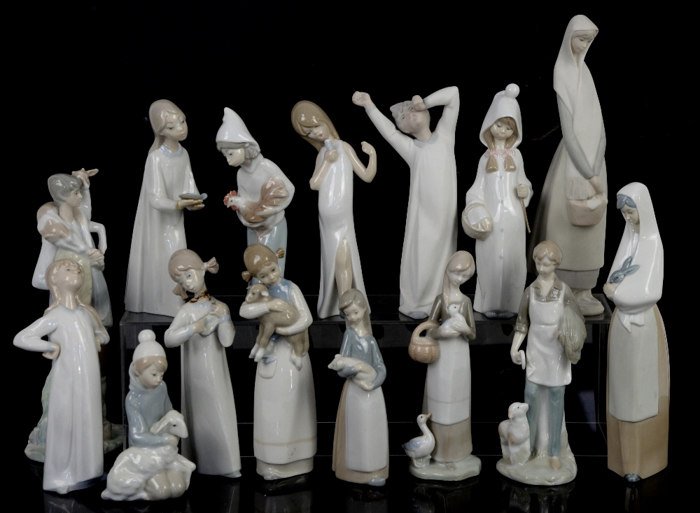 Quantity of Lladro figurines; figure holding lamb, figure holding goat, girl with chicken,