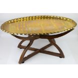 Middle eastern oval brass tray table, with folding base
