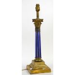 Brass Corinthian column table lamp, with blue and clear glass column on stepped square base, H53cm
