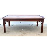 20th century rectangular mahogany coffee table with tapered supports. 106W x 41H x 61D