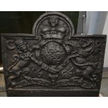 Reproduction cast iron fire back with arched cresting bearing the Royal Coat of Arms, 63cm x 71cm