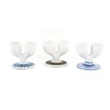 Troika pottery three double egg cups, one stamped 'Troika St. Ives' to base, h9 x w10.